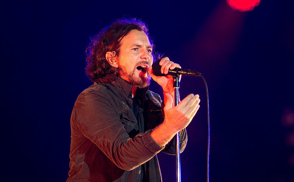 Eddie Vedder of Pearl Jam on stage with a microphone but no guitar