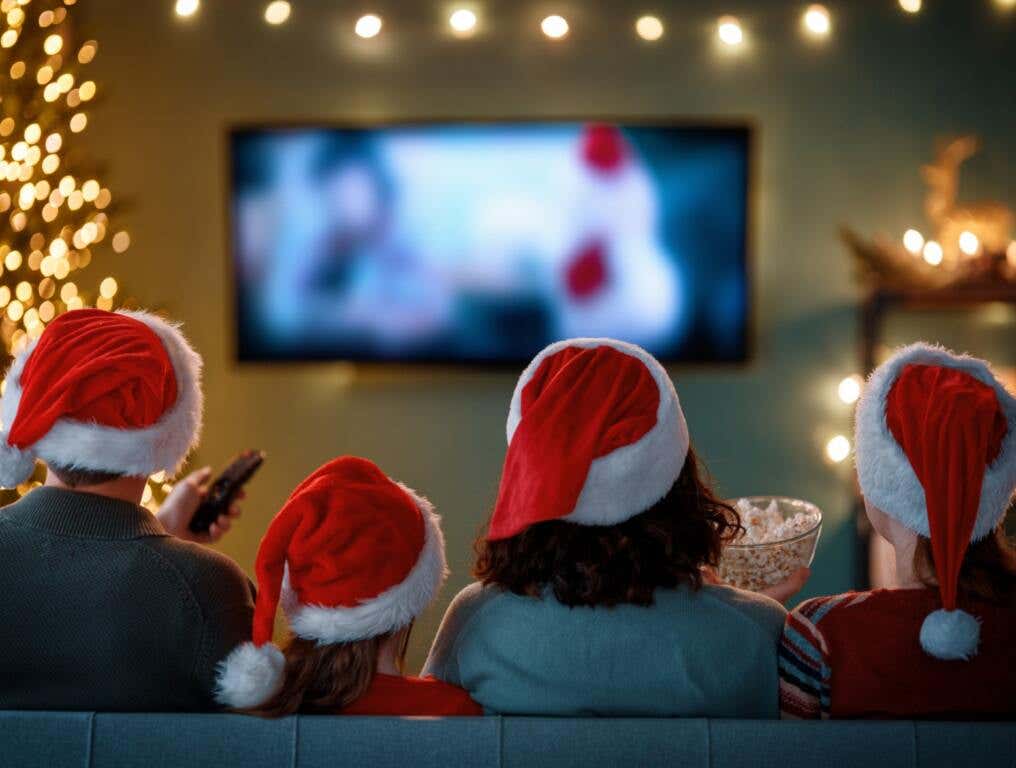 A family watching a holiday classic on tv.