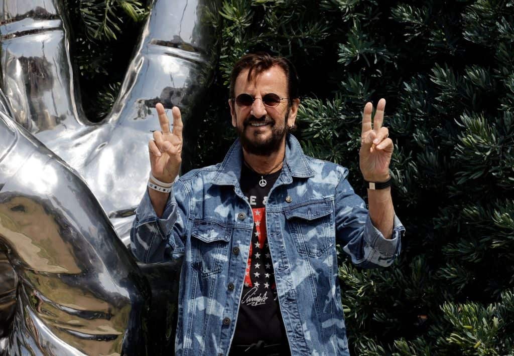 Ringo Starr saying "peace and love"