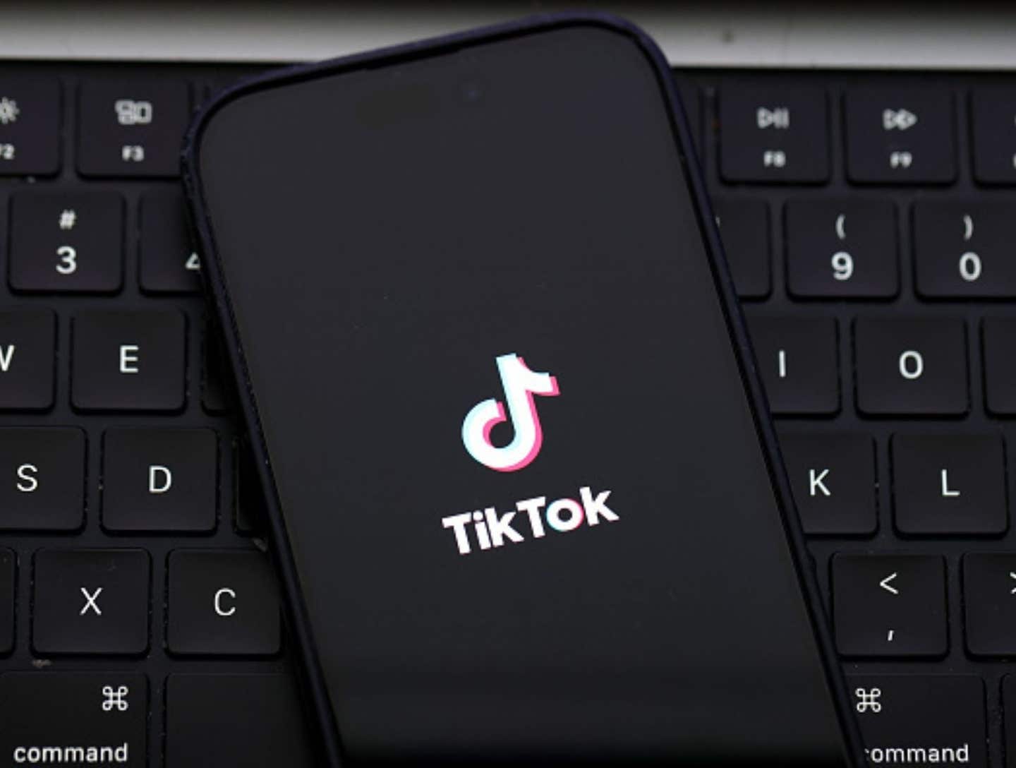 In this photo illustration, the TikTok logo is displayed on an iPhone screen on December 06, 2024 in San Anselmo, California. A three-judge panel of the U.S. Court of Appeals in Washington, D.C., has upheld a law mandating China-based ByteDance to sell the popular social media app TikTok or face a ban in the United States. ByteDance has until January 19, 2025 to sell the company