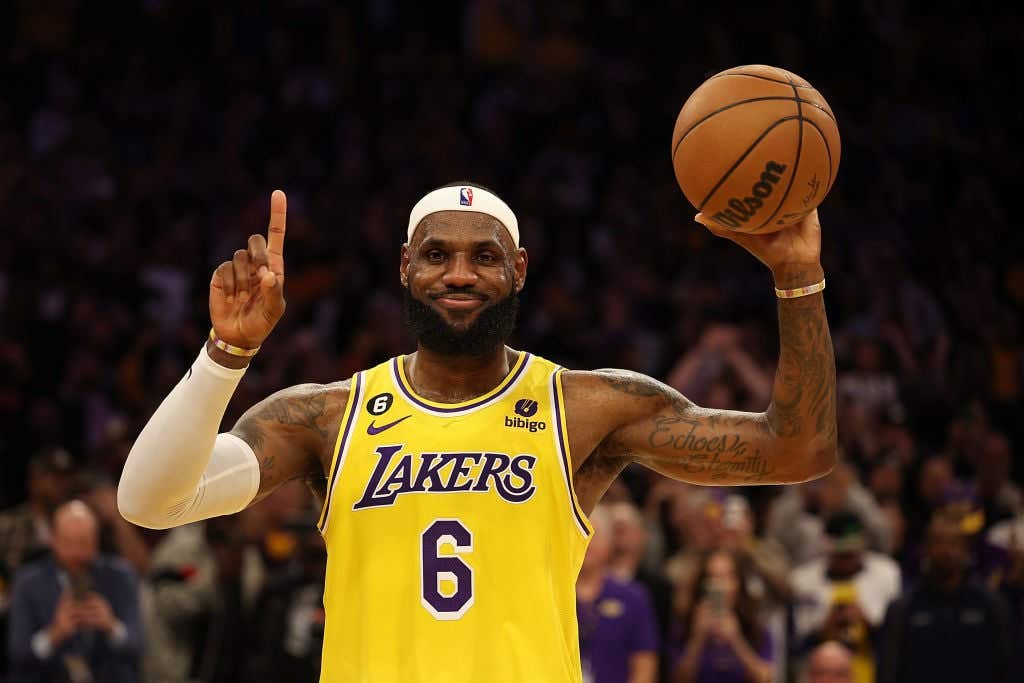 LeBron James wearing his number 8 Lakers jersey and holding a ball