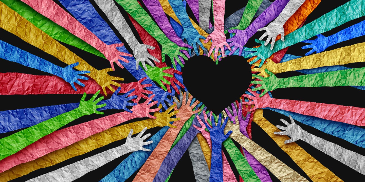 Diverse people United as social diversity and unity partnership as heart hands in a community group connected together shaped as a support symbol expressing the feeling of teamwork and togetherness.