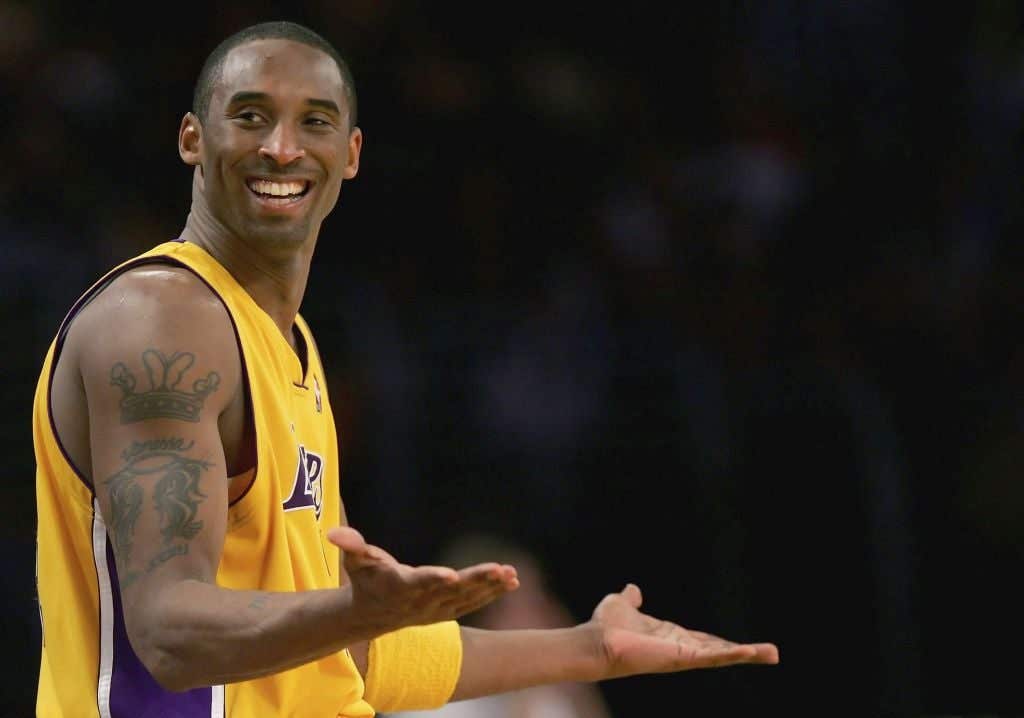 Kobe Bryant on the basketball court smiling during Miami Heat v Los Angeles Lakers game