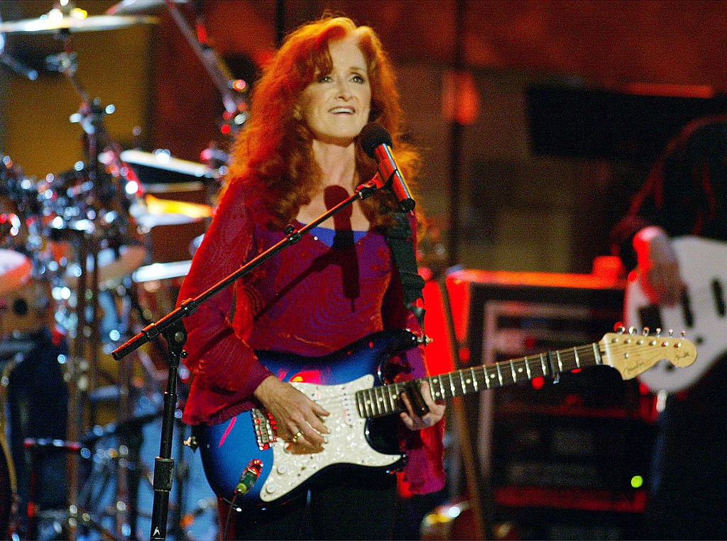 Singer Bonnie Raitt  performs on stage during the WOMEN ROCK! Songs from the Movies, the fourth annual concert for the fight against breast cancer, at the Kodak Theatre September 30, 2003 in Hollywood, California. 