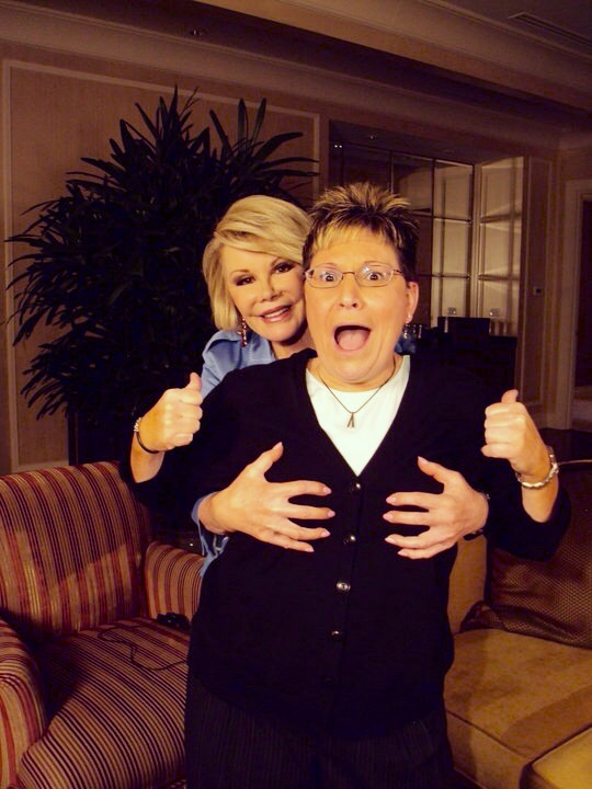 Joan Rivers standing behind Carla Rea 