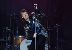 Mick Jagger performing on stage.